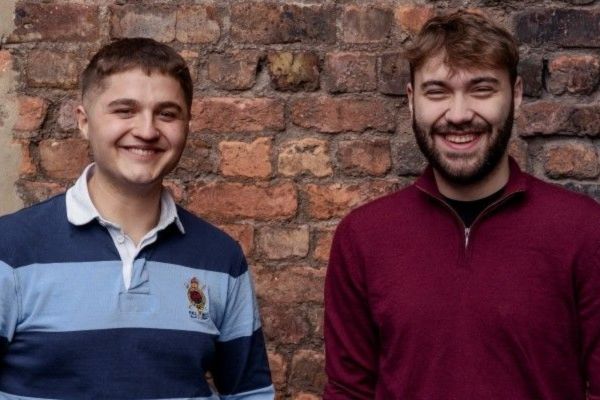 Plato founders Dragos Popa and Nikita Dumitriuc, smiling.