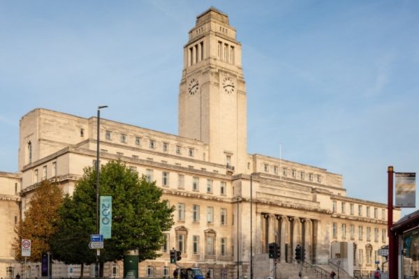 The University of Leeds' Parkinson Building, a grand white stone building with a tall clock tower and stone columns at its entrance.