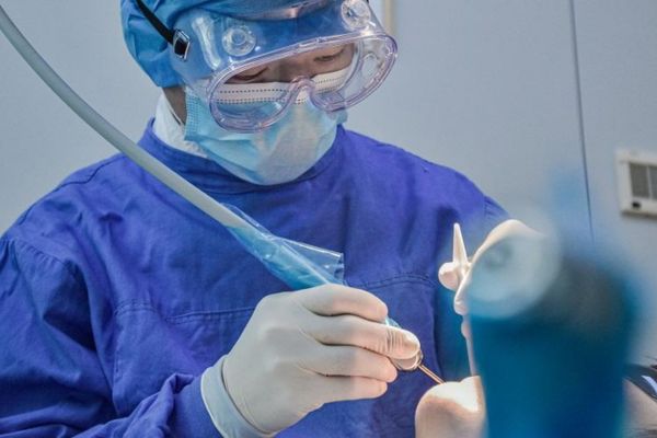 A dentist treating a patient
