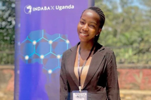 A smiling student at the Deep Learning IndabaX Uganda conference in Kampala, Uganda.