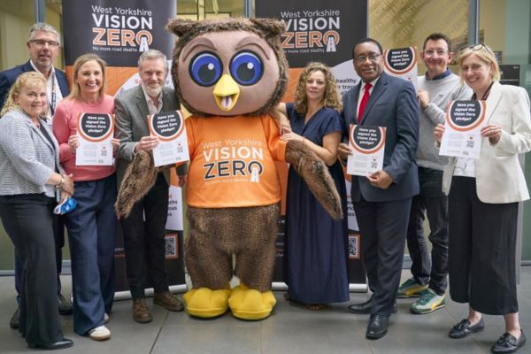 Members of the Leeds Anchor Network mark the Vision Zero pledge with a mascot owl.