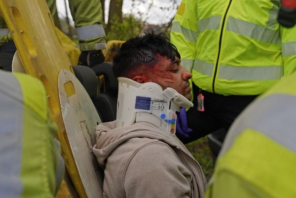 Emergency services put a neck brace on the victim of a crash resulting from drug-driving in a film shot by Leeds students.