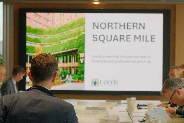 Meeting participants view a presentation about the Northern Square Mile