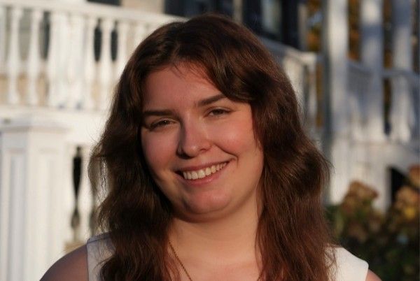 Headshot of Sami smiling at the camera.