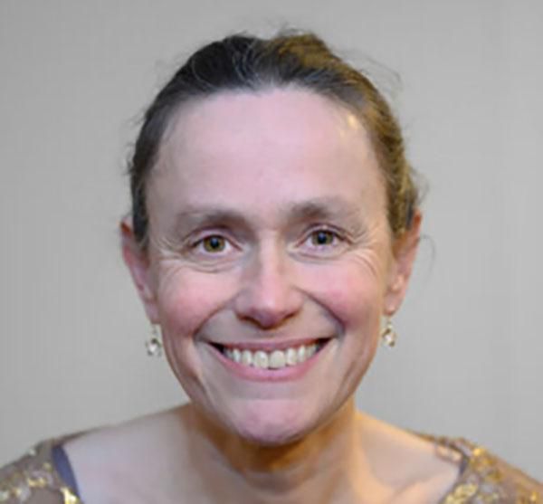 Headshot of person smiling and facing camera