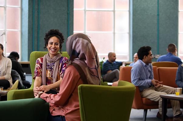 Student Haleemah Alaydi sat with a fellow student in a cafe.