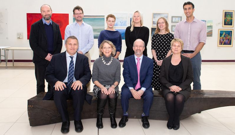 Group photograph of radiotherapy researchers - five men and five women - smiling at camera, in the Leeds Cancer Centre.