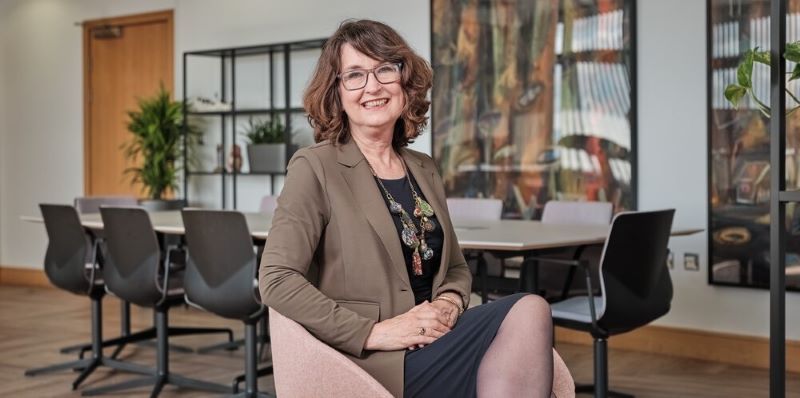 Professor Simone Buitendijk is pictured sitting in an office, smiling