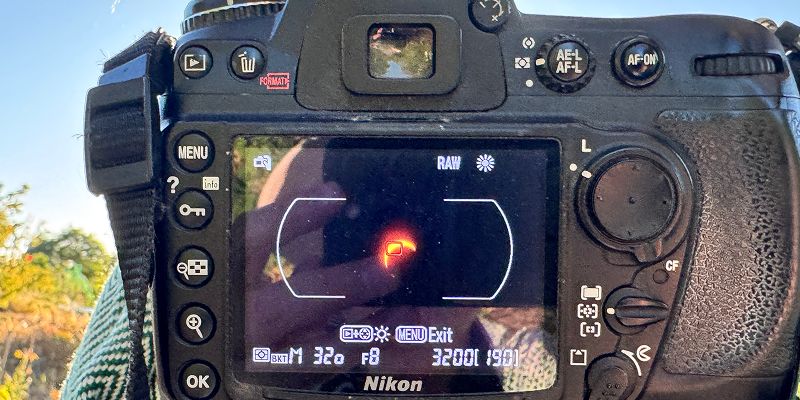 A camera screen, with a solar eclipse visible on it