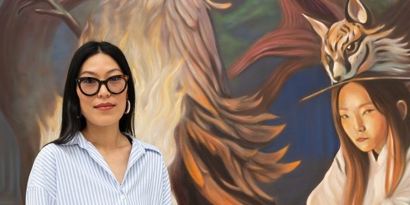 Artist Zadie Xa, one of the artists shortlisted for the Turner Prize, with one of her paintings behind her.
