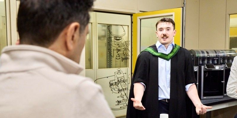 Cameron explains his project to Alex Sobel, MP. 