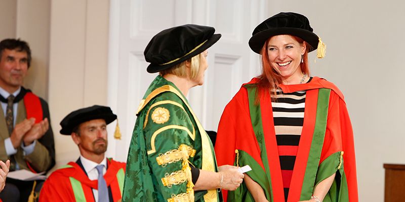 Alice Roberts wearing a cap and gown at a graduation ceremony