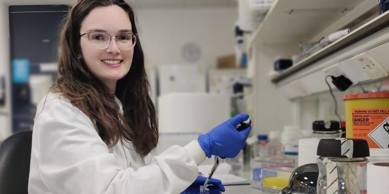 Amanda sits in a lab at the University of Leeds carrying out a test.
