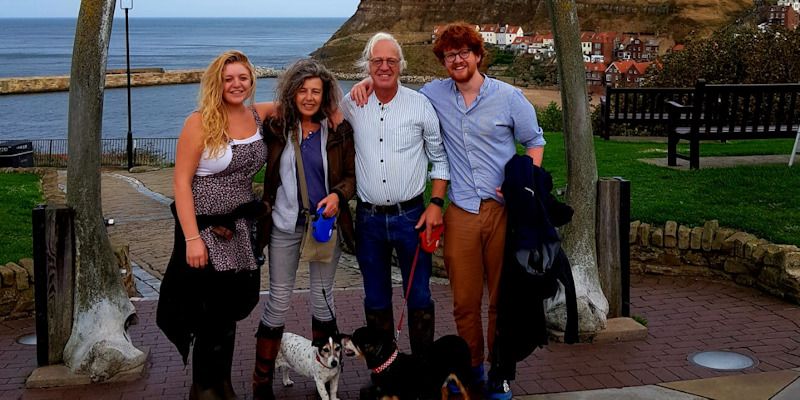 Andrew Mason with his happy family by the beach