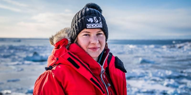 Dr Anna Hogg, with a polar landscape in the background