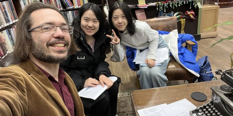 Austin Woerner and students working on poetry translation.