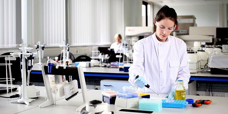 Postgraduate student carrying out research in a biological sciences lab