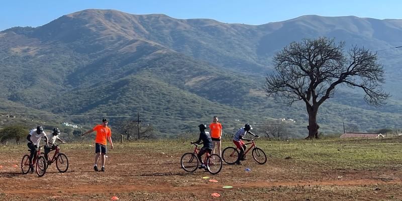 Children learning how to ride bikes