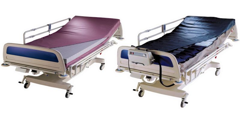 Foam and air mattress side by side on hospital beds