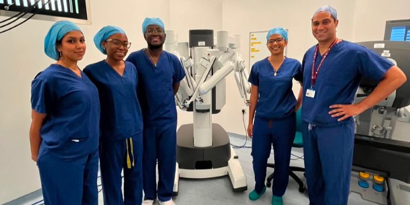 CariSurg students with Dr Nikita Greenidge and Dr Jonathan Noel in a surigcal theatre in London.