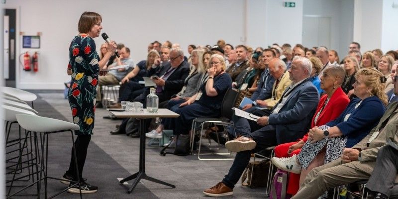 Professor Shearer West presents the Civic Exchange to a large room full of people sat in the audience.