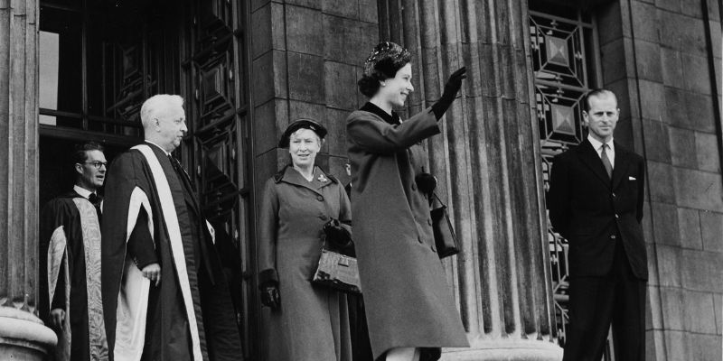 The Queen visited the University of Leeds in 1958. Here she waves to the crowd on the Parkinson steps, with the Chancellor, the Princess Royal behind, the Vice-Chancellor, Sir Charles Morris standing to her right and the Duke of Edinburgh to her left