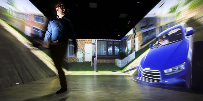 Man crossing street in front of car in VR