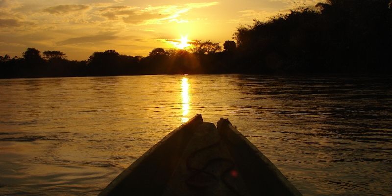 A shot of a sun setting over a tropical river. Credit: Emilio Vilanova