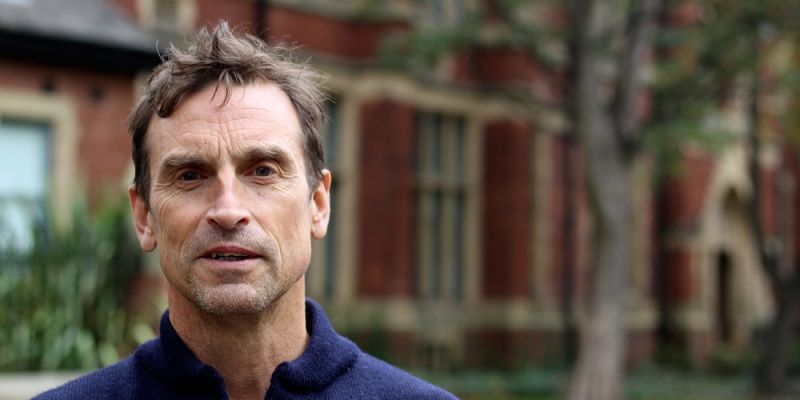 A profile image of Kenton Cool standing outside the Baines at the University of Leeds