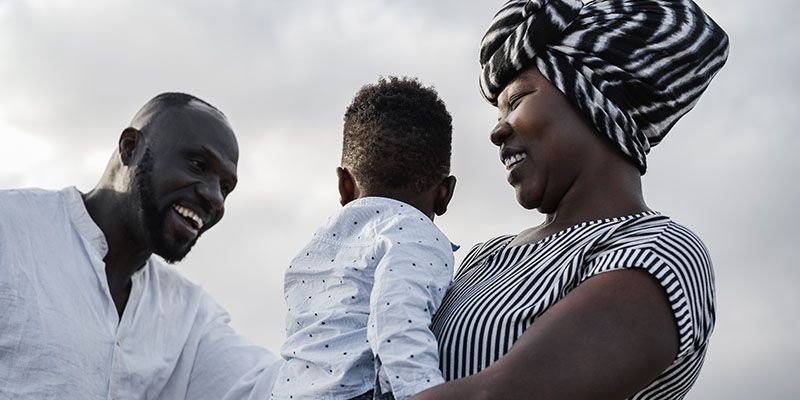 An African family laugh and smile together