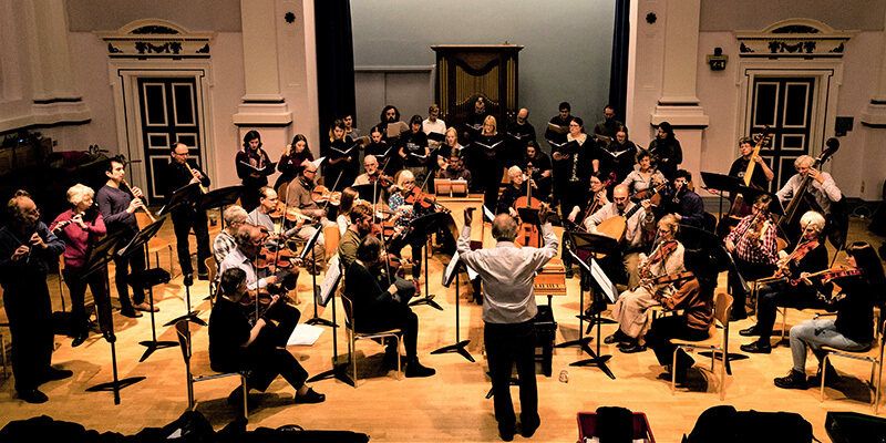 An orchestra performing in the Clothworkers Centenary Concert Hall.