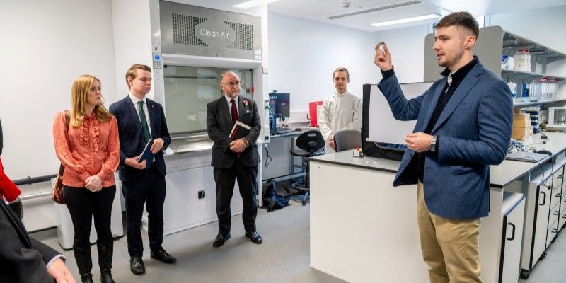 Henry Dunne co-founder of MNS holds up the company's innovative vaccination patch to the audience of MPs.