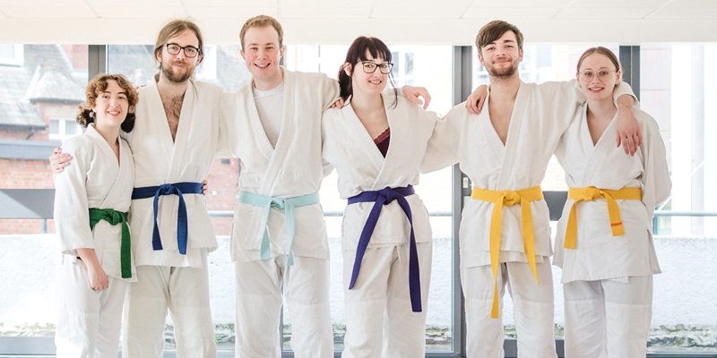 A group of six people, including Jack, wearing ju-jitsu clothing