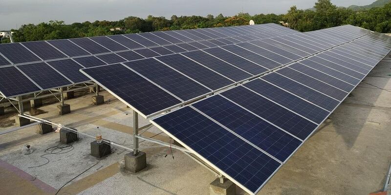 Close up of two long rows of solar panels, outdoors