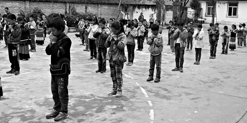 Praying school children