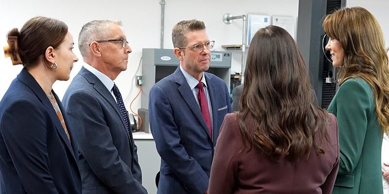Professor stephen russell and members of the hainsworth team meeting Kate Middleton
