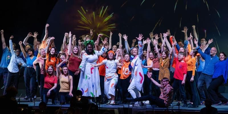 Bradford schoolchildren celebrate at then end of their Sing, Dance, Leap performance.