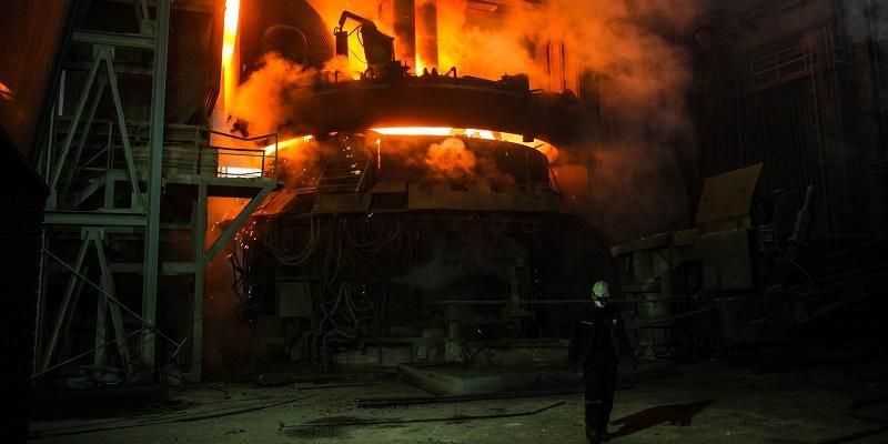 The image shows the organge glow from super hot metal in a blast furnace