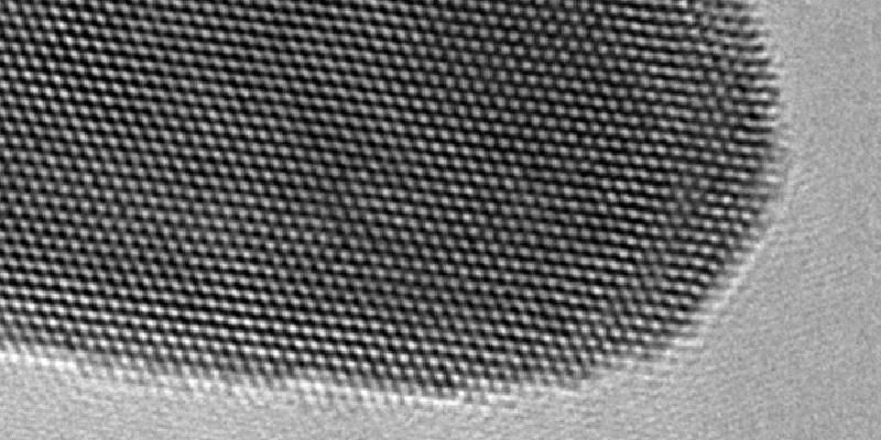 Image shows a picture from an electron microscope showing tightly packed atoms 
