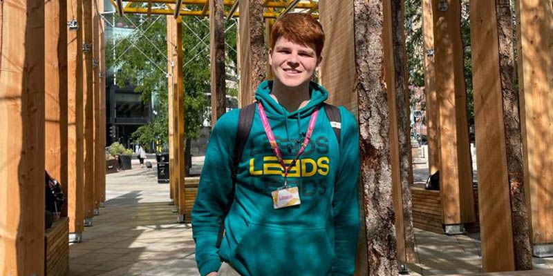 Student Richard O'Brien, smiling in a Leeds 2023 hoodie.