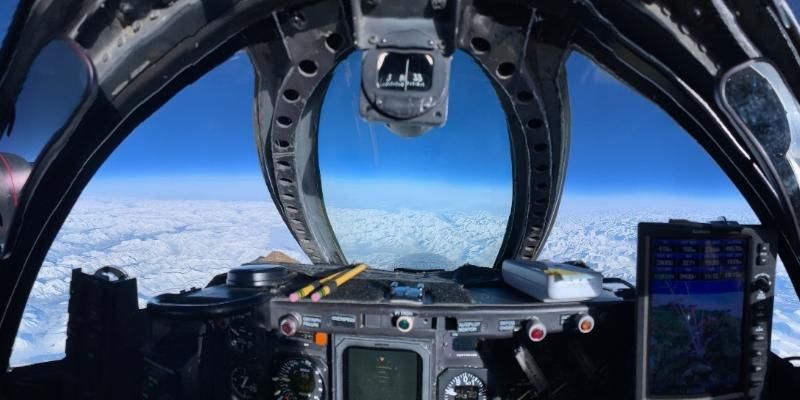 View of blue sky and clouds from the cockpit of NASA’s research aircraft