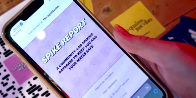Someone views the Spike Report on their phone.