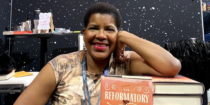 Tananarive Due with a copy of her book, the reformatory