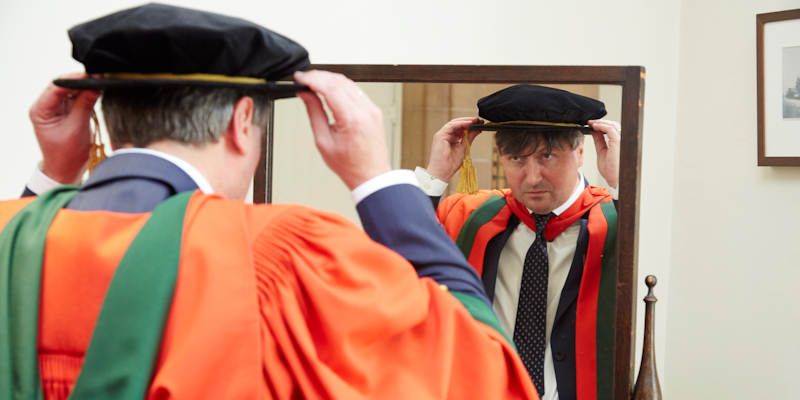 Professor Simon Armitage prepares to receive his honorary doctorate at the University of Leeds, June 2015