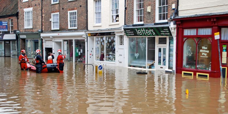 A rescue team helps residents out of properties in Walmgate York during the Christmas floods in 2015.