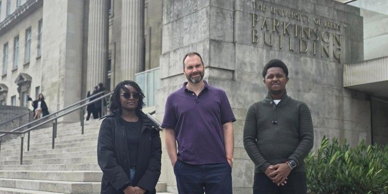 L-R: Lorna Mugambi, Professor Richard Mann and Yuri Njathi stood outside the Parkinson building on the steps.