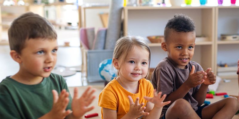 Young children clapping in an Early Childhood Education and Care setting