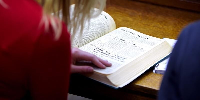 A student studies a law book