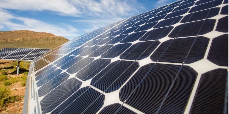 Solar panels in an African landscape.