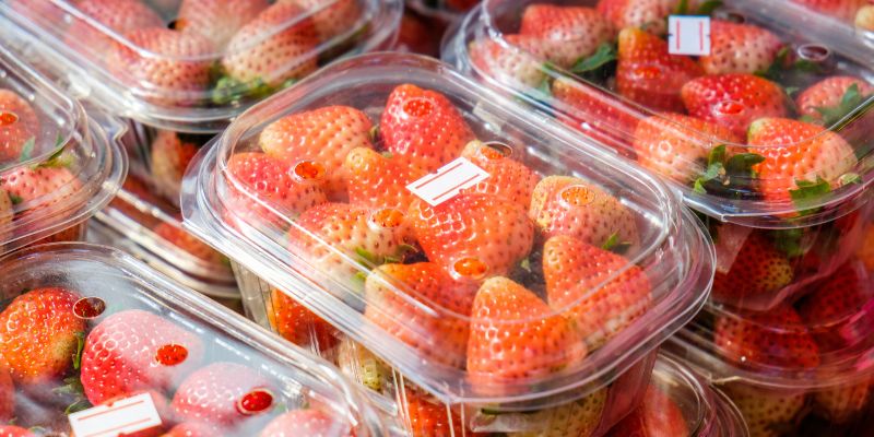 Punnets of strawberries on a supermarket shelf